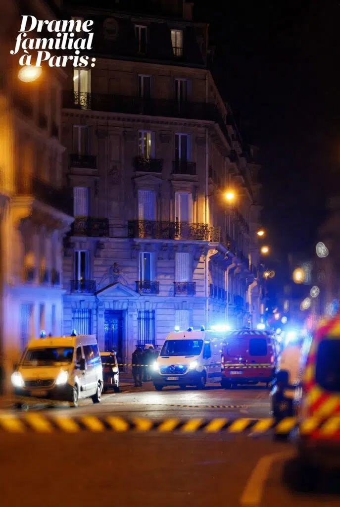 Immeuble parisien de nuit avec véhicules de secours et périmètre de sécurité après un drame familial à Paris